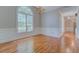 Bright dining room features hardwood floors, wainscoting, and a large arched window at 13935 Brown Bridge Rd, Covington, GA 30016