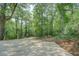Cemented driveway with gorgeous foliage for ultimate privacy with plenty of space for guest parking at 13935 Brown Bridge Rd, Covington, GA 30016