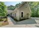 View of accessible entry ramp to the house, side door, and well-maintained landscaping at 13935 Brown Bridge Rd, Covington, GA 30016