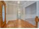 Inviting foyer with beautiful hardwood flooring, and an intricate decorative front door for welcoming guests at 13935 Brown Bridge Rd, Covington, GA 30016