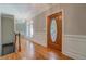 Bright foyer boasts a beautiful hardwood floor, intricate molding, and stunning light fixtures throughout the home at 13935 Brown Bridge Rd, Covington, GA 30016