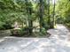 Charming home nestled among lush trees with a long driveway leading to the front entrance at 13935 Brown Bridge Rd, Covington, GA 30016