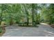 Charming home nestled among lush trees with a long driveway leading to the front entrance at 13935 Brown Bridge Rd, Covington, GA 30016