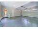 Large garage with neutral walls, painted floors, automatic door, and plenty of space at 13935 Brown Bridge Rd, Covington, GA 30016