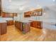 Spacious kitchen has stainless appliances, large island, and wooden cabinets at 13935 Brown Bridge Rd, Covington, GA 30016