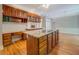 Open-concept kitchen with island, granite countertops, and seamless flow to the dining area at 13935 Brown Bridge Rd, Covington, GA 30016