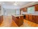 Bright and airy kitchen features a large island, wooden cabinets, and modern appliances at 13935 Brown Bridge Rd, Covington, GA 30016