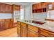 Kitchen island has granite counters, cooktop, and ample storage at 13935 Brown Bridge Rd, Covington, GA 30016