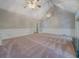 Expansive living room featuring a high ceiling with ceiling fans and wainscoting at 13935 Brown Bridge Rd, Covington, GA 30016
