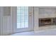 A living room features a door to an outdoor space, and a fireplace with marble accents at 13935 Brown Bridge Rd, Covington, GA 30016