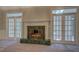 Living room with marble fireplace, french doors, and plenty of natural light at 13935 Brown Bridge Rd, Covington, GA 30016