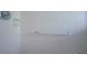 The shower features white tile and a shower bar at 13935 Brown Bridge Rd, Covington, GA 30016