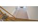 A staircase with white railings and wood banisters leads to a living room and fireplace at 13935 Brown Bridge Rd, Covington, GA 30016