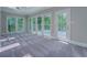 Sun room with large windows, ceiling fan and access to back deck at 13935 Brown Bridge Rd, Covington, GA 30016