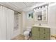 Updated bathroom featuring a shower-tub, updated vanity with storage and bright lighting at 4025 Demooney Rd, Atlanta, GA 30349