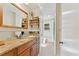 Charming bathroom with a wood-framed mirror and stylish vanity, complemented by a walk-in shower at 4025 Demooney Rd, Atlanta, GA 30349