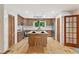 Bright, modern kitchen with wood cabinetry, white countertops, and a functional center island at 4025 Demooney Rd, Atlanta, GA 30349