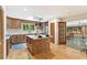 Well-lit kitchen with modern appliances, a center island, and wood floors at 4025 Demooney Rd, Atlanta, GA 30349