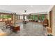 Open living room bathed in natural light with polished concrete floors and scenic outdoor views, perfect for entertaining at 4025 Demooney Rd, Atlanta, GA 30349