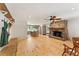 Bright living room featuring a stone fireplace, wood floors, and an open floor plan at 4025 Demooney Rd, Atlanta, GA 30349