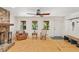 Sun-filled living room with wood flooring, a fireplace, and large windows overlooking the yard at 4025 Demooney Rd, Atlanta, GA 30349