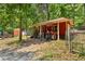 Outbuilding with a tractor, providing space for storage and equipment on the property at 4025 Demooney Rd, Atlanta, GA 30349