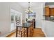 Bright dining room with natural light, hardwood floors and modern chandelier at 2465 Main St # 201, Atlanta, GA 30344