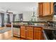 Open kitchen featuring stainless steel appliances, granite countertops and breakfast bar area at 2465 Main St # 201, Atlanta, GA 30344