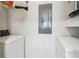 Laundry room with white washer and dryer machines, white walls, and a utility closet at 2465 Main St # 201, Atlanta, GA 30344
