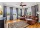 Cozy living room with hardwood floors, bright windows, and comfortable leather furniture at 2465 Main St # 201, Atlanta, GA 30344