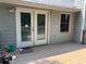 A cozy back deck with double doors, perfect for relaxing or entertaining outdoors at 403 Hickory Walk, Woodstock, GA 30188