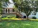 Charming backyard with a wooden deck and stairs leading to a lush green lawn at 403 Hickory Walk, Woodstock, GA 30188