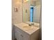 Neutral bathroom with a white vanity, light countertop, and a large mirror at 403 Hickory Walk, Woodstock, GA 30188