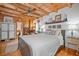 Bright and airy bedroom with hardwood floors, white shiplap accent wall, and ensuite bathroom at 521 East Valley Ne Rd, Rydal, GA 30171