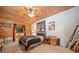 Cozy bedroom with wood paneled ceiling, neutral walls and ample natural light at 521 East Valley Ne Rd, Rydal, GA 30171