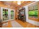 Light-filled entryway with french doors, a breakfast bar, and hardwood floors at 521 East Valley Ne Rd, Rydal, GA 30171
