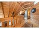 Charming upstairs hallway with wood paneled ceilings and walls leads to a bedroom suite at 521 East Valley Ne Rd, Rydal, GA 30171