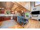 Eat-in kitchen features wood cabinets, stainless appliances, and access to the backyard at 521 East Valley Ne Rd, Rydal, GA 30171