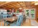 Open kitchen features wood cabinets, stainless appliances, and large island with breakfast bar at 521 East Valley Ne Rd, Rydal, GA 30171