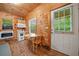 Cozy eat-in kitchen features wood-paneled walls, tile floors, and natural light at 521 East Valley Ne Rd, Rydal, GA 30171