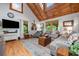 Cozy living room with vaulted wood ceilings, hardwood floors, and comfortable seating at 521 East Valley Ne Rd, Rydal, GA 30171