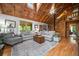Inviting living room featuring vaulted wood ceilings, staircase and comfortable seating at 521 East Valley Ne Rd, Rydal, GA 30171