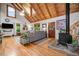 Cozy living room with vaulted wood ceilings, hardwood floors, wood stove, and comfortable seating at 521 East Valley Ne Rd, Rydal, GA 30171