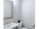 Well-lit bathroom features vanity, sink, faucet, toilet, tissue holder, and mirror at 992 Harvest Park Ln, Suwanee, GA 30024