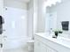 Updated bathroom with tub, tiled shower, double vanity, modern fixtures and decor at 992 Harvest Park Ln, Suwanee, GA 30024
