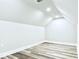 Bright bonus room featuring wood-look flooring, neutral walls, and recessed lighting for a modern and versatile space at 992 Harvest Park Ln, Suwanee, GA 30024