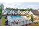 Community pool with lounge chairs and covered patio overlooking neighborhood homes at 992 Harvest Park Ln, Suwanee, GA 30024