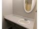 Well-lit bathroom with a clean vanity and a decorative mirror at 2566 Stratford Ln, Morrow, GA 30260