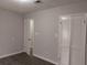 Neutrally painted bedroom with closet and open door at 2566 Stratford Ln, Morrow, GA 30260