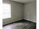 Inviting bedroom showcasing a window allowing natural light into the space at 2566 Stratford Ln, Morrow, GA 30260